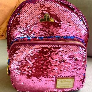 “Make it pink & make it blue Loungefly”from Sleeping Beauty.